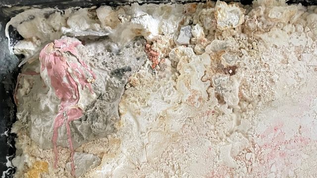 Pale globby textures with pink drips.